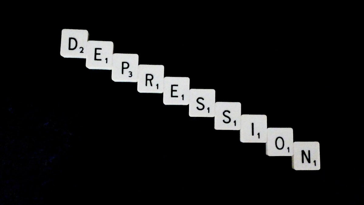Depression, spelled out in white scrabble tiles.